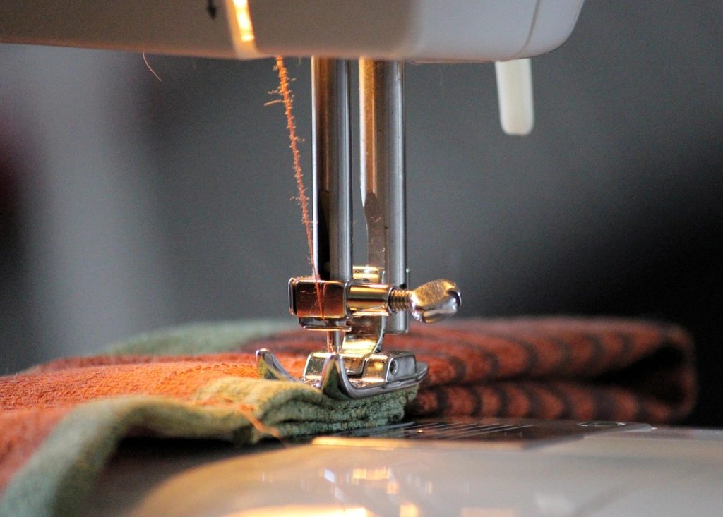Sewing machine stitching upholstery fabric