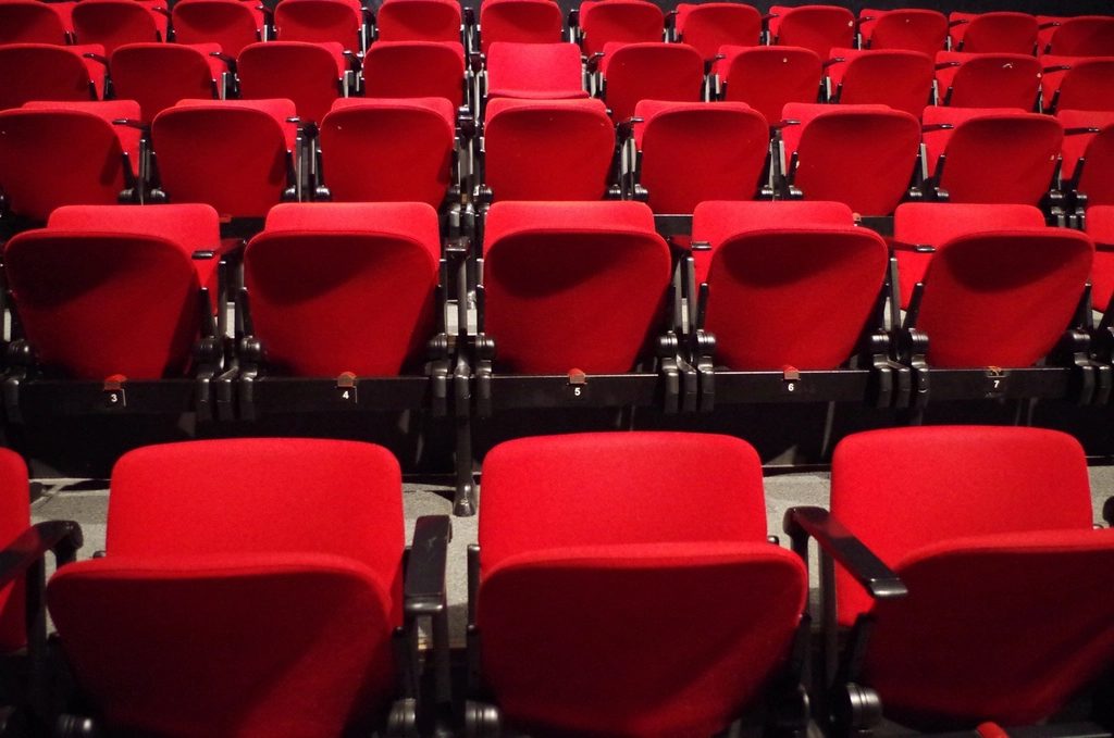 Rows of red theater seating